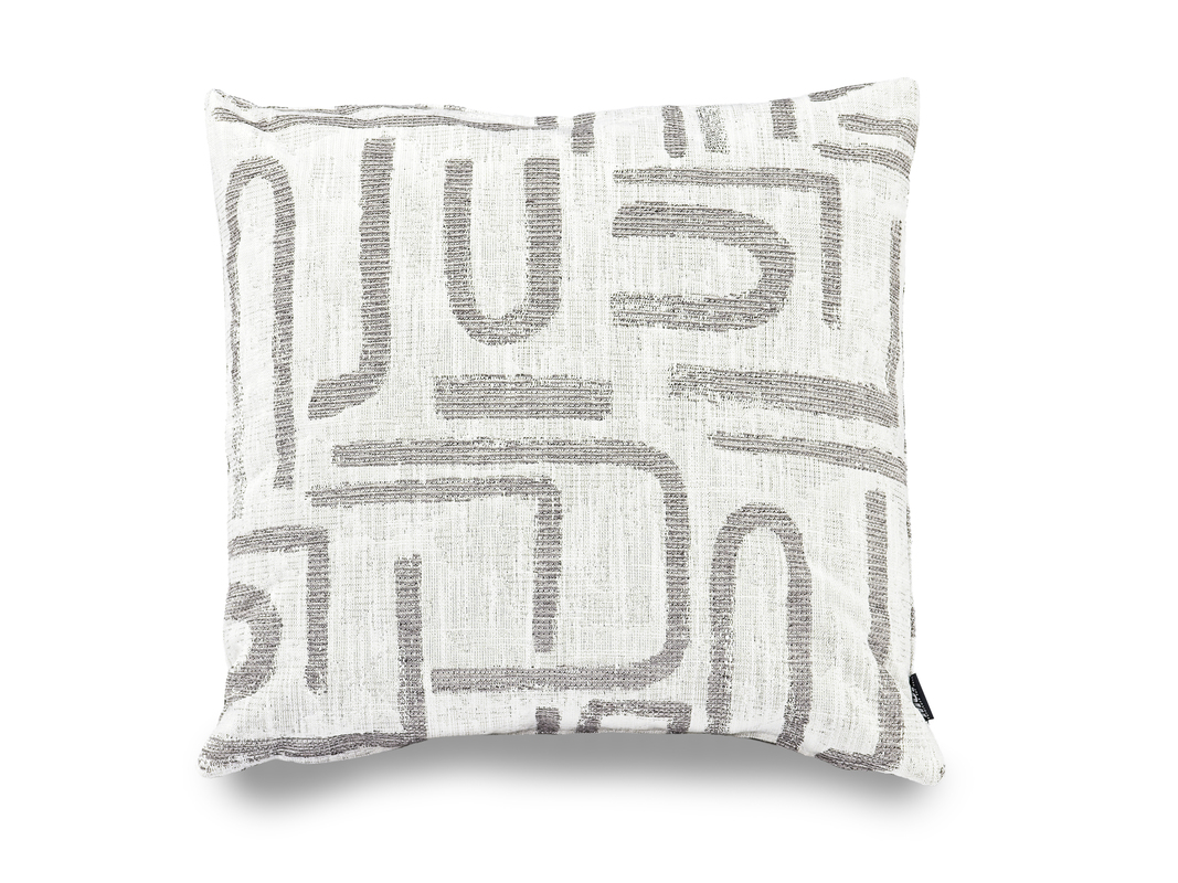 Ivory accent pillow with gray J, U, and L-shaped patterns.